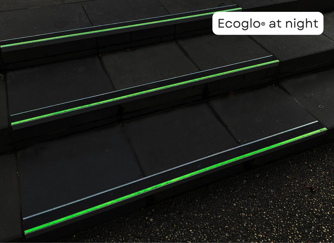Ecoglo photoluminescent carpet stair nosing glowing when lighting is reduced